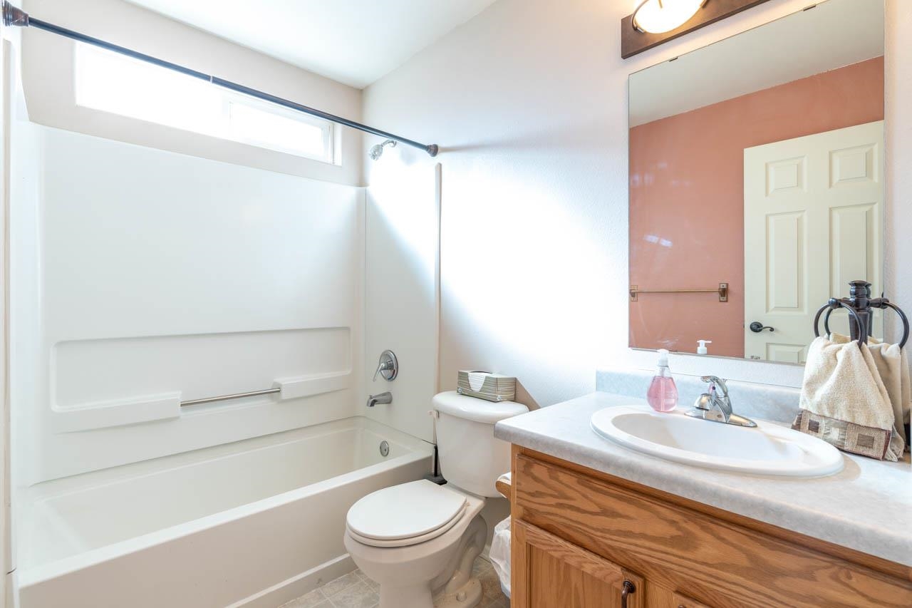1458 Powell Street Fruita, CO 81521 - Photo 18 of 27 a bathroom with a sink toilet and shower