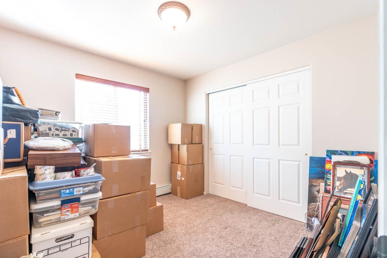 1458 Powell Street Fruita, CO 81521 - Photo 19 of 27 a storage room with washer and dryer