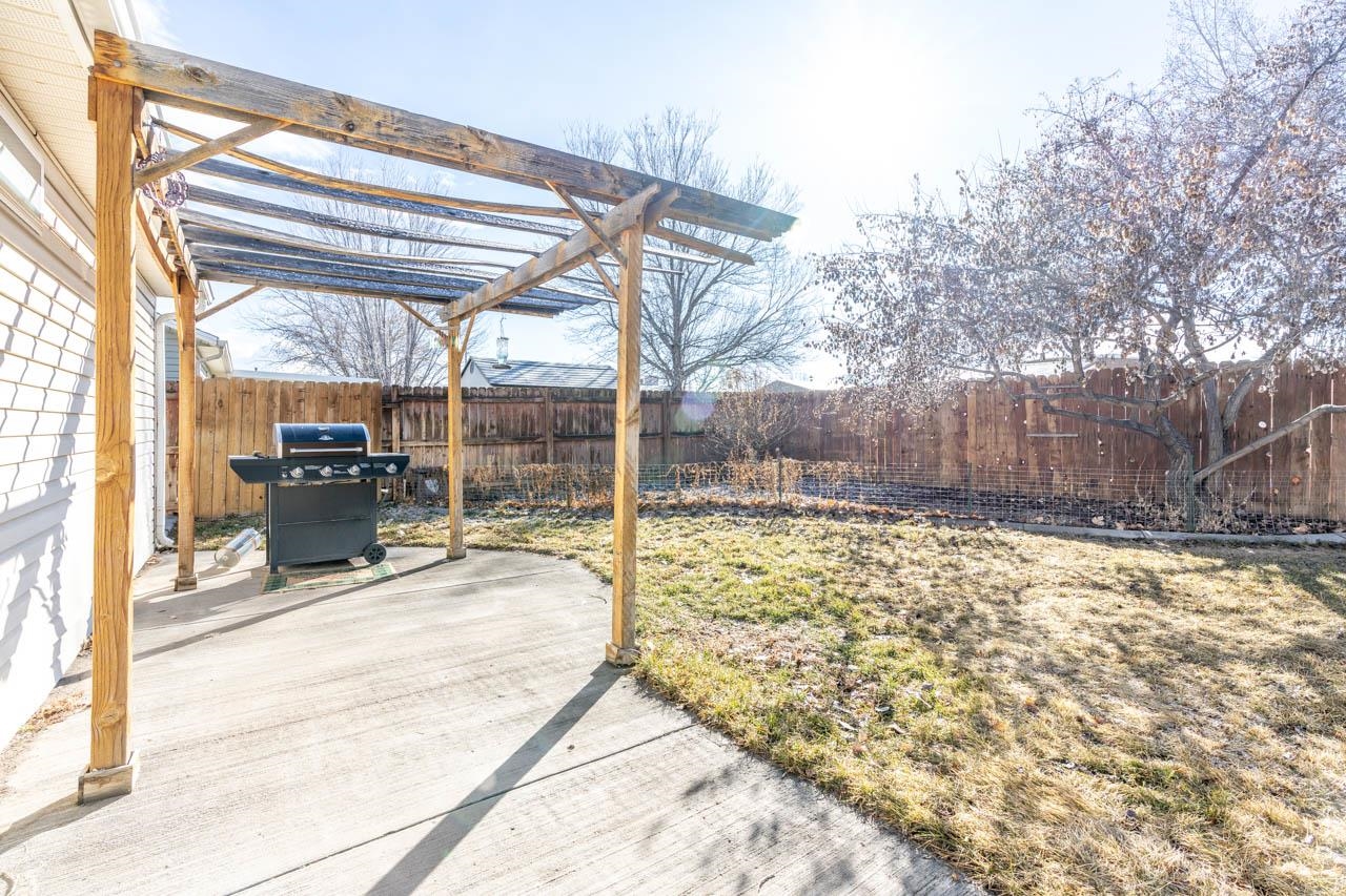 1458 Powell Street Fruita, CO 81521 - Photo 20 of 27 a view of a house with a snow in the yard