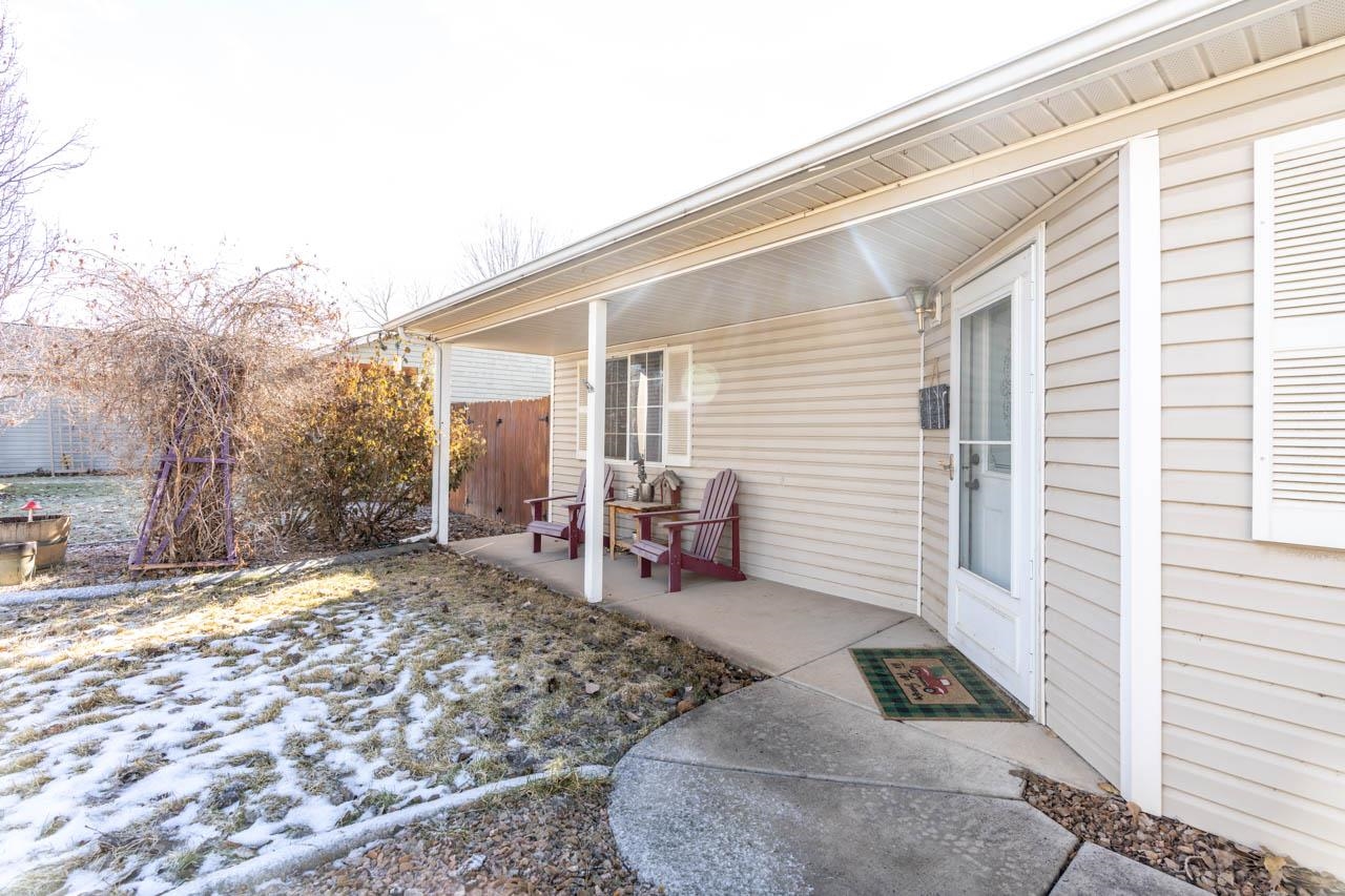 1458 Powell Street Fruita, CO 81521 - Photo 24 of 27 a view of a backyard with a patio