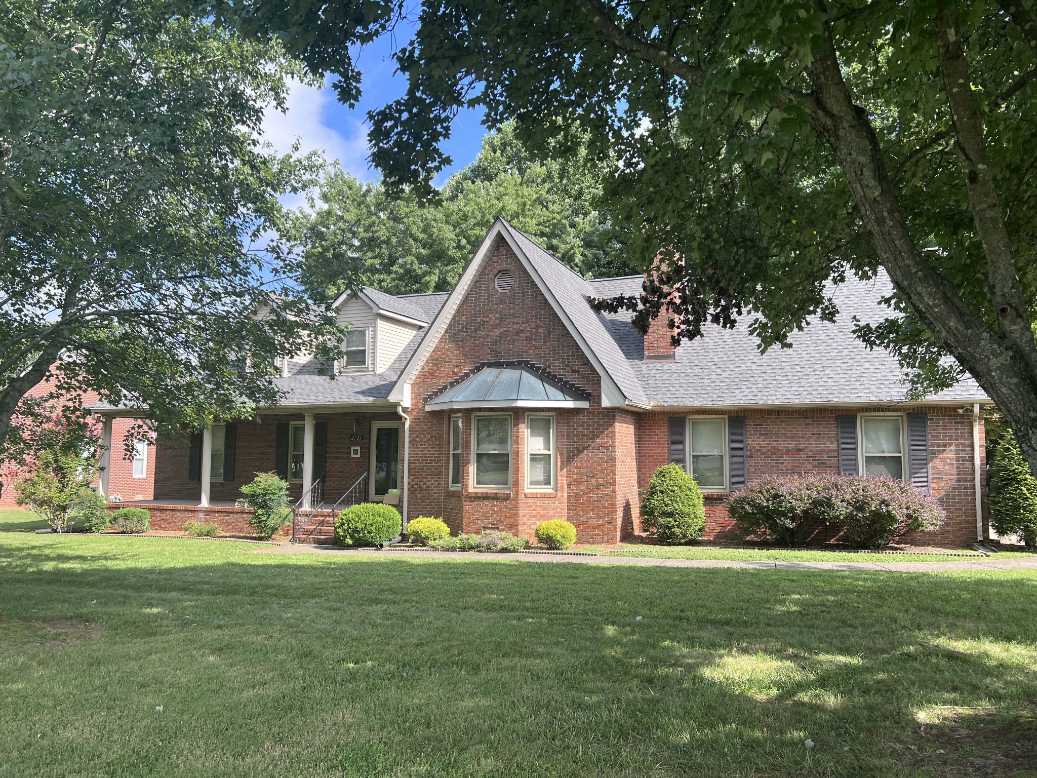 a front view of a house with garden