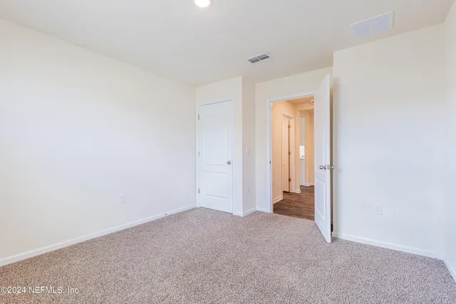 a view of hallway with closet