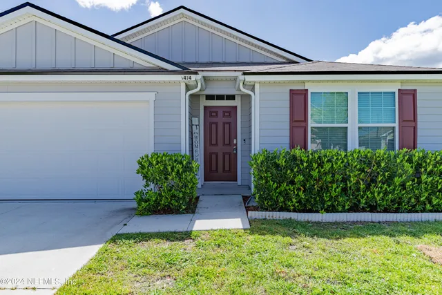 a front view of house with a yard