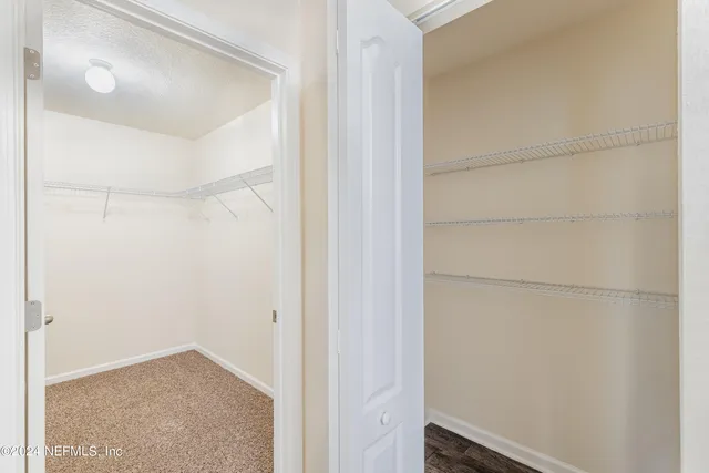 a bathroom with a double vanity sink mirror double and bathtub