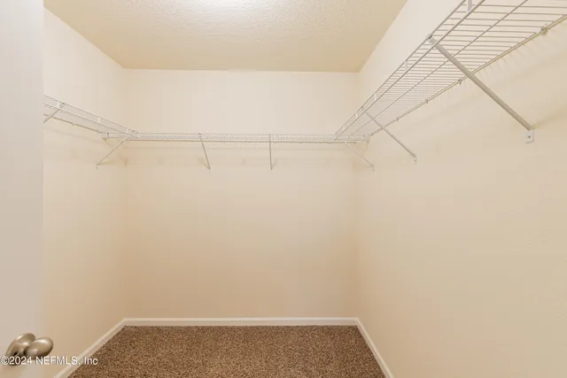 a bathroom with a double vanity sink and mirror