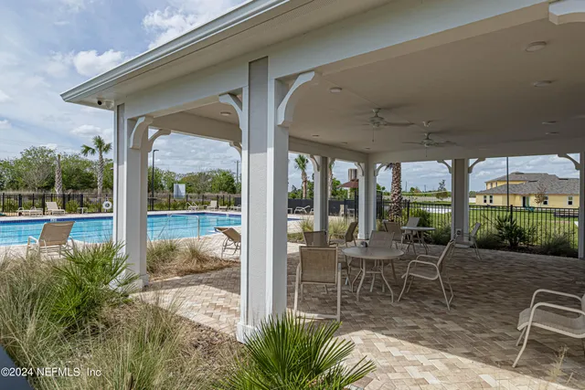 a front view of a house with a garden and yard