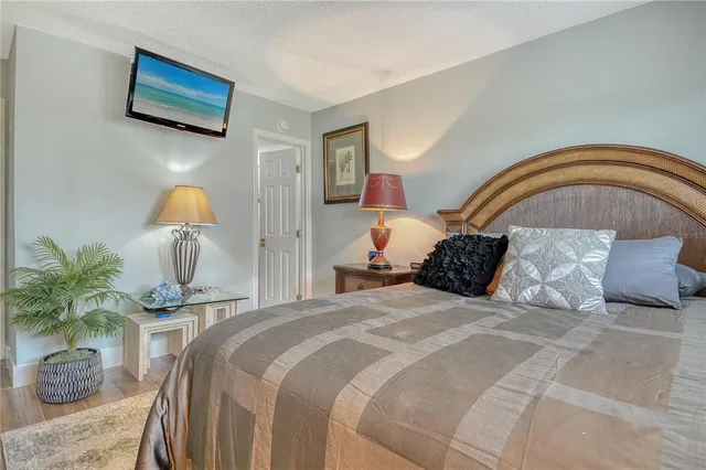 a front view of a house with a garden and yard