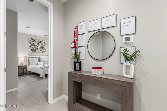 a bathroom with a toilet mirror and a sink
