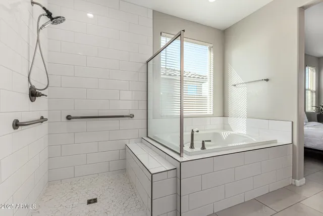a bathroom with a sink a bath tub and a shower
