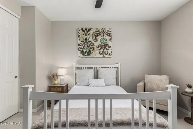 a bedroom with a bed and lamp