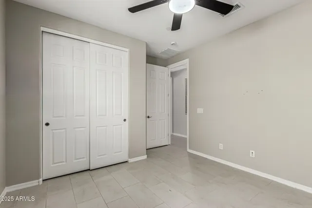 an empty room with fan