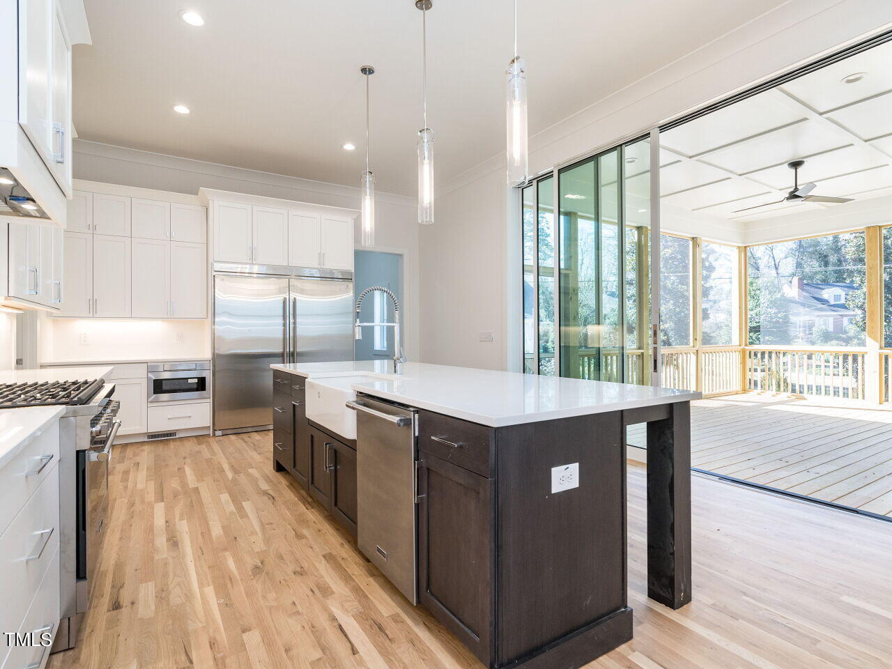 301 Shepherd Street Raleigh, NC 27607 - Photo 15 of 37 a kitchen with stainless steel appliances granite countertop a sink a stove and a wooden floors