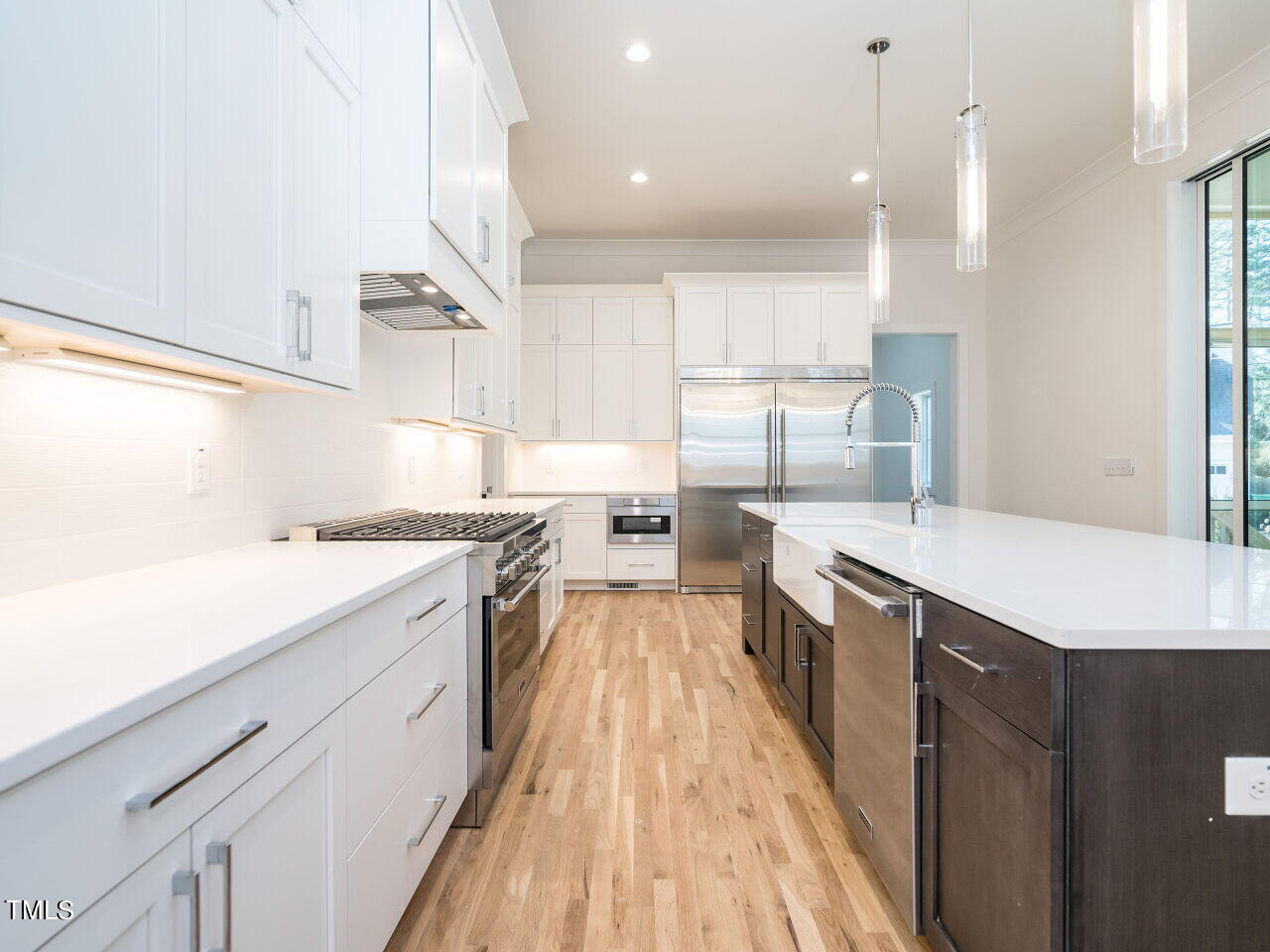 301 Shepherd Street Raleigh, NC 27607 - Photo 16 of 37 a large kitchen with a large counter top a sink stainless steel appliances and cabinets