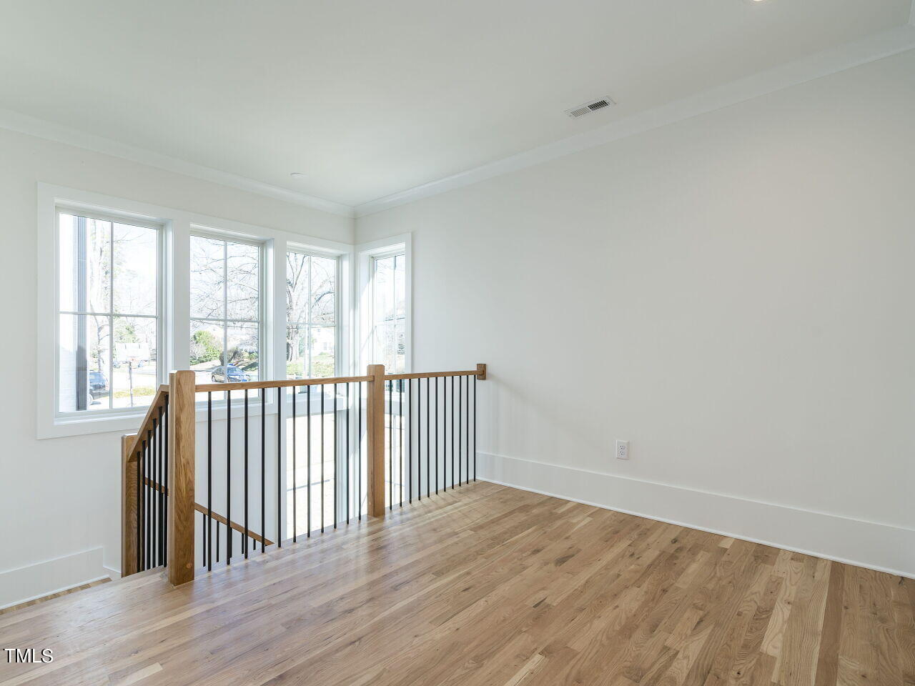301 Shepherd Street Raleigh, NC 27607 - Photo 22 of 37 a view of a room with wooden floor and windows