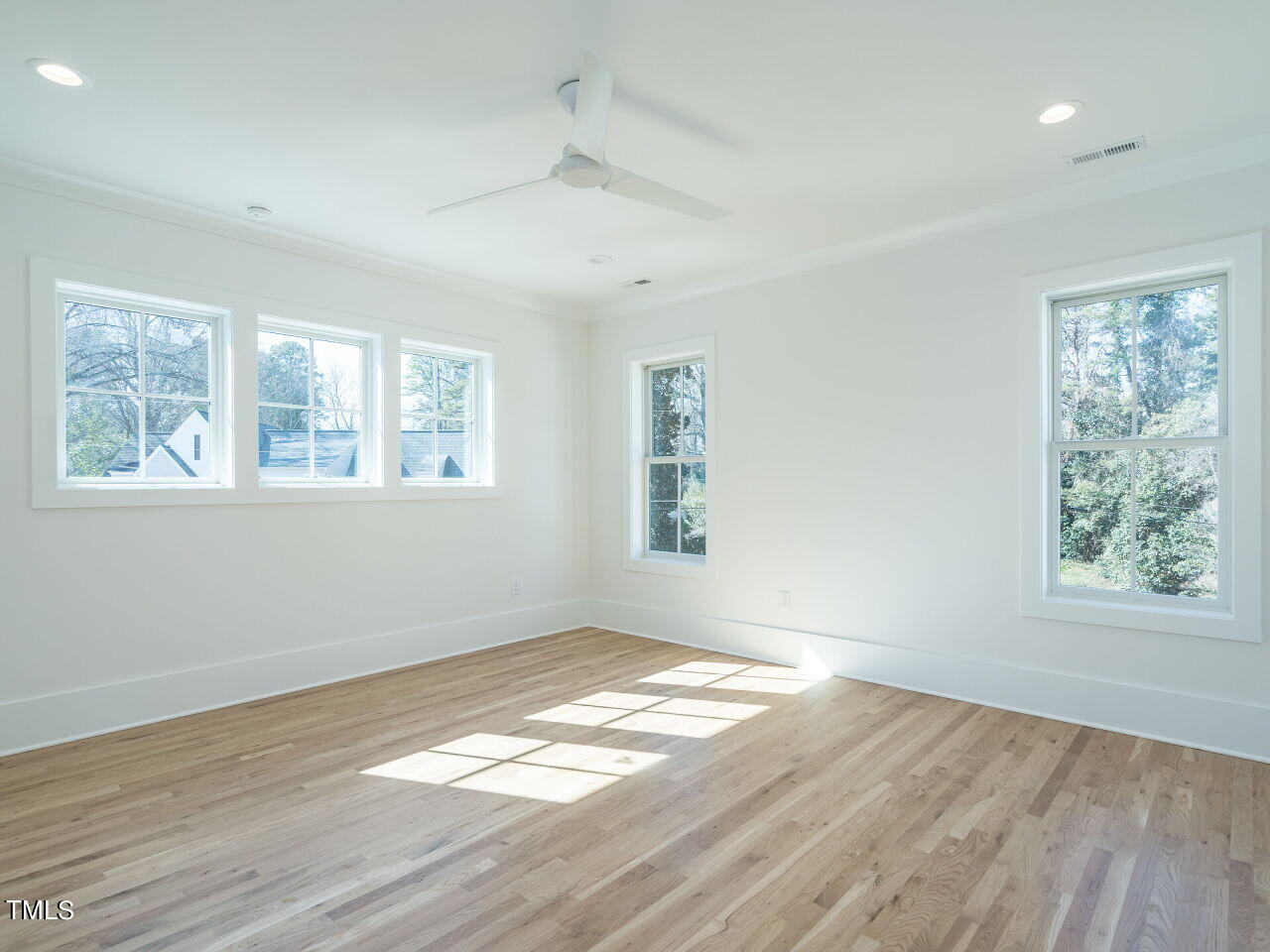 301 Shepherd Street Raleigh, NC 27607 - Photo 24 of 37 a view of empty room with wooden floor and fan