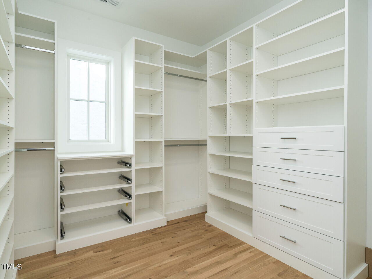 301 Shepherd Street Raleigh, NC 27607 - Photo 28 of 37 a view of walk in closet with empty racks