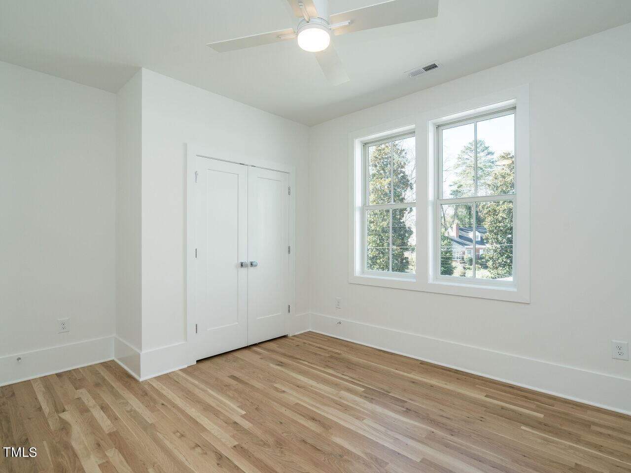 301 Shepherd Street Raleigh, NC 27607 - Photo 31 of 37 a view of an empty room with wooden floor and a window
