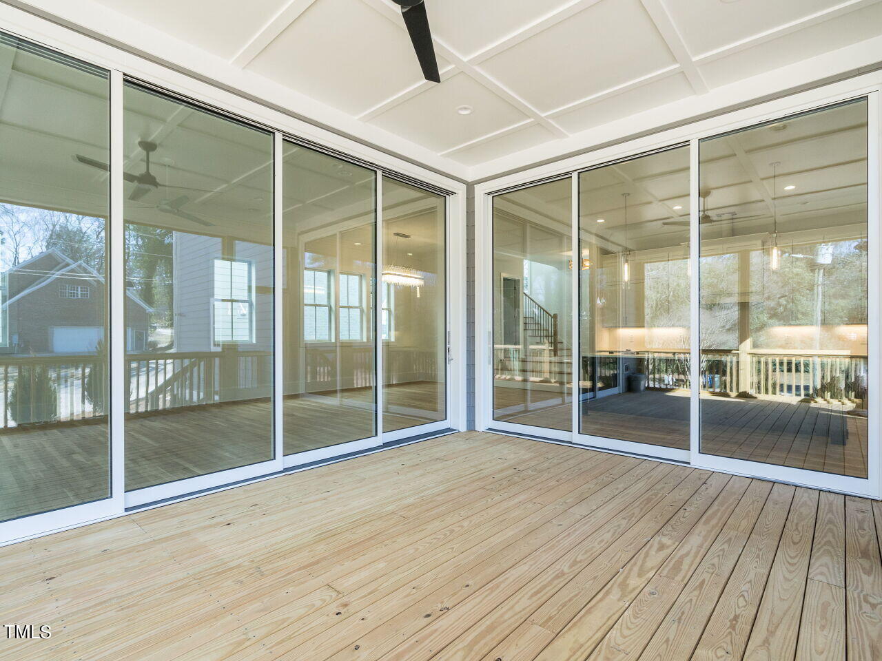 301 Shepherd Street Raleigh, NC 27607 - Photo 5 of 37 a room with wooden floor and windows