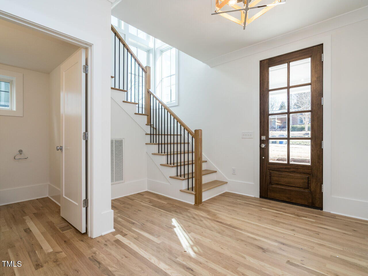 301 Shepherd Street Raleigh, NC 27607 - Photo 8 of 37 wooden floor in an empty room with a window and wooden floor