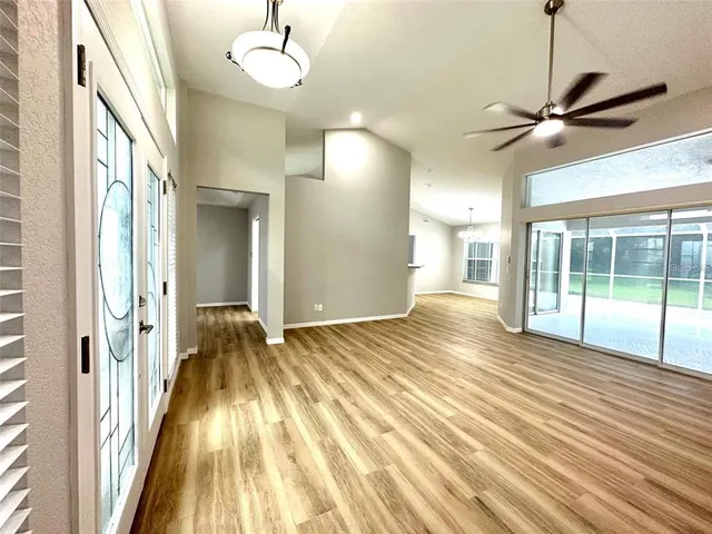 a view of a room with wooden floor