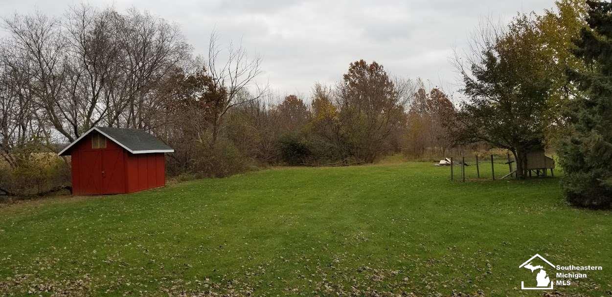 5922 Leroux Road Newport, MI 48166 - Photo 6 of 23 View from Upper Bedroom to backyard