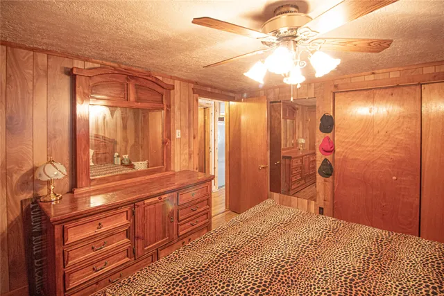 a bathroom with a shower a sink and a mirror