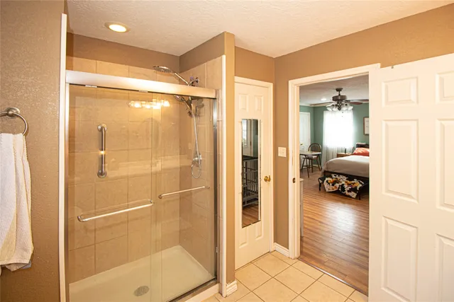a en suite bathroom with a shower and a tub