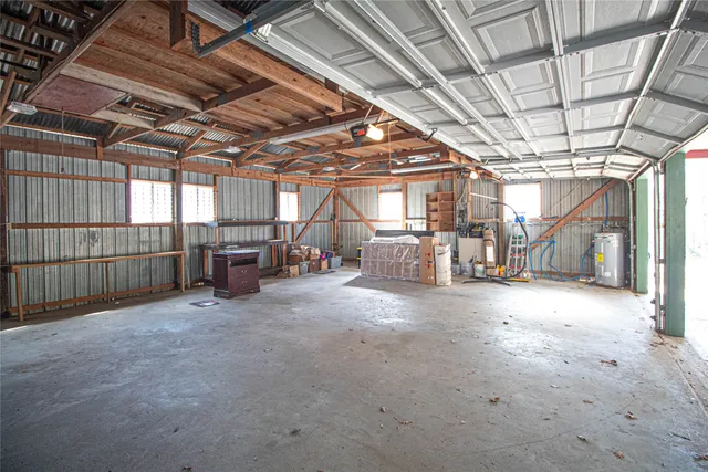 a view of empty room with wooden ceiling