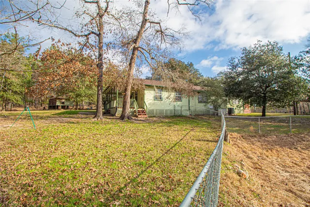 a backyard of a house with outdoor seating
