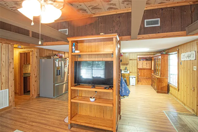 a view of a living room with a flat screen tv