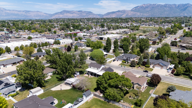 5727 South 3550th Street West Roy, UT 84067 - Photo 44 of 49 Residential neighborhood featuring mature trees and mountain backdrops