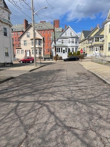 23 Plumer Street Everett, MA 02149 - Photo 2 of 29 a view of a city street with large buildings