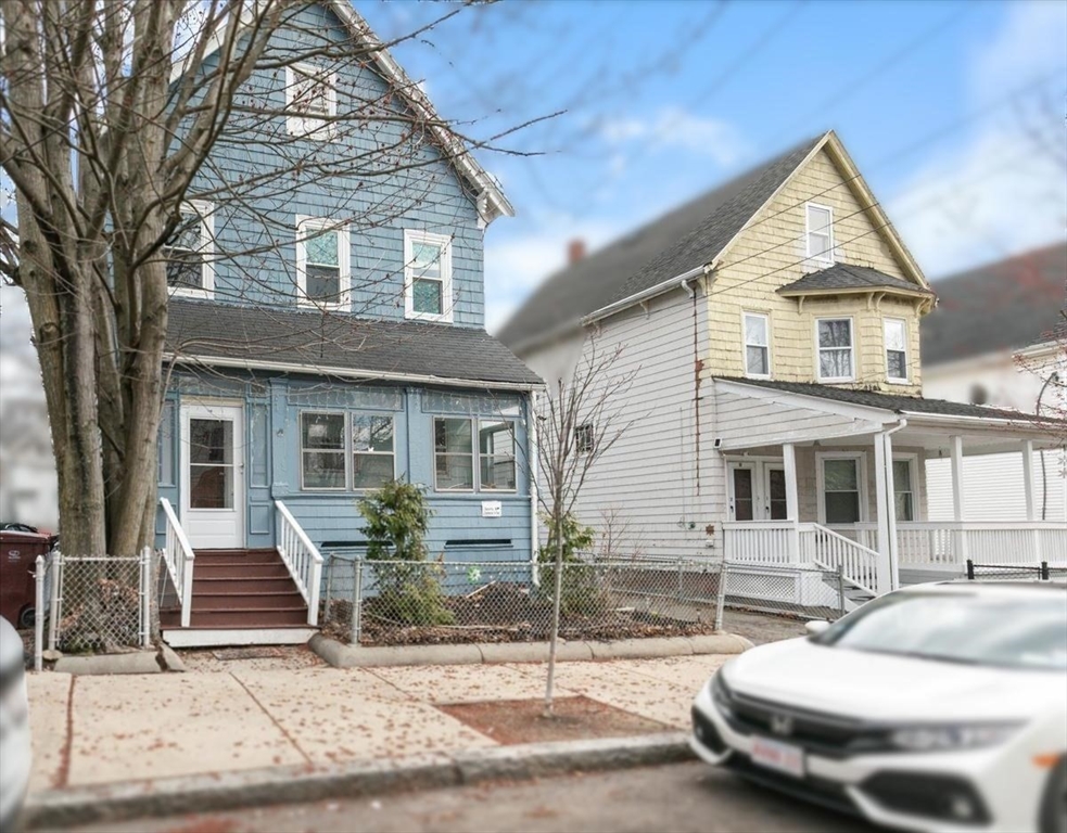 23 Plumer Street Everett, MA 02149 - Photo 25 of 29 a front view of a house with a yard