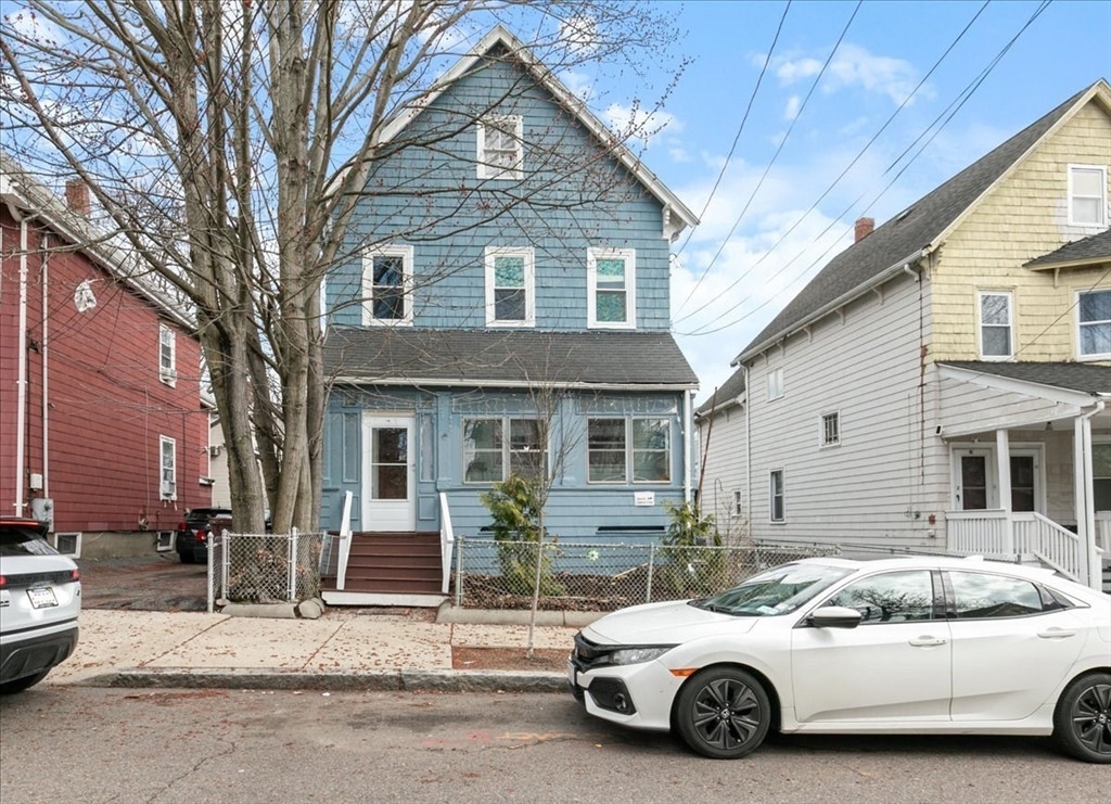 23 Plumer Street Everett, MA 02149 - Photo 26 of 29 a car parked in front of a house