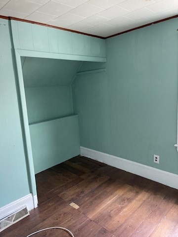 23 Plumer Street Everett, MA 02149 - Photo 10 of 29 an empty room with a mirror