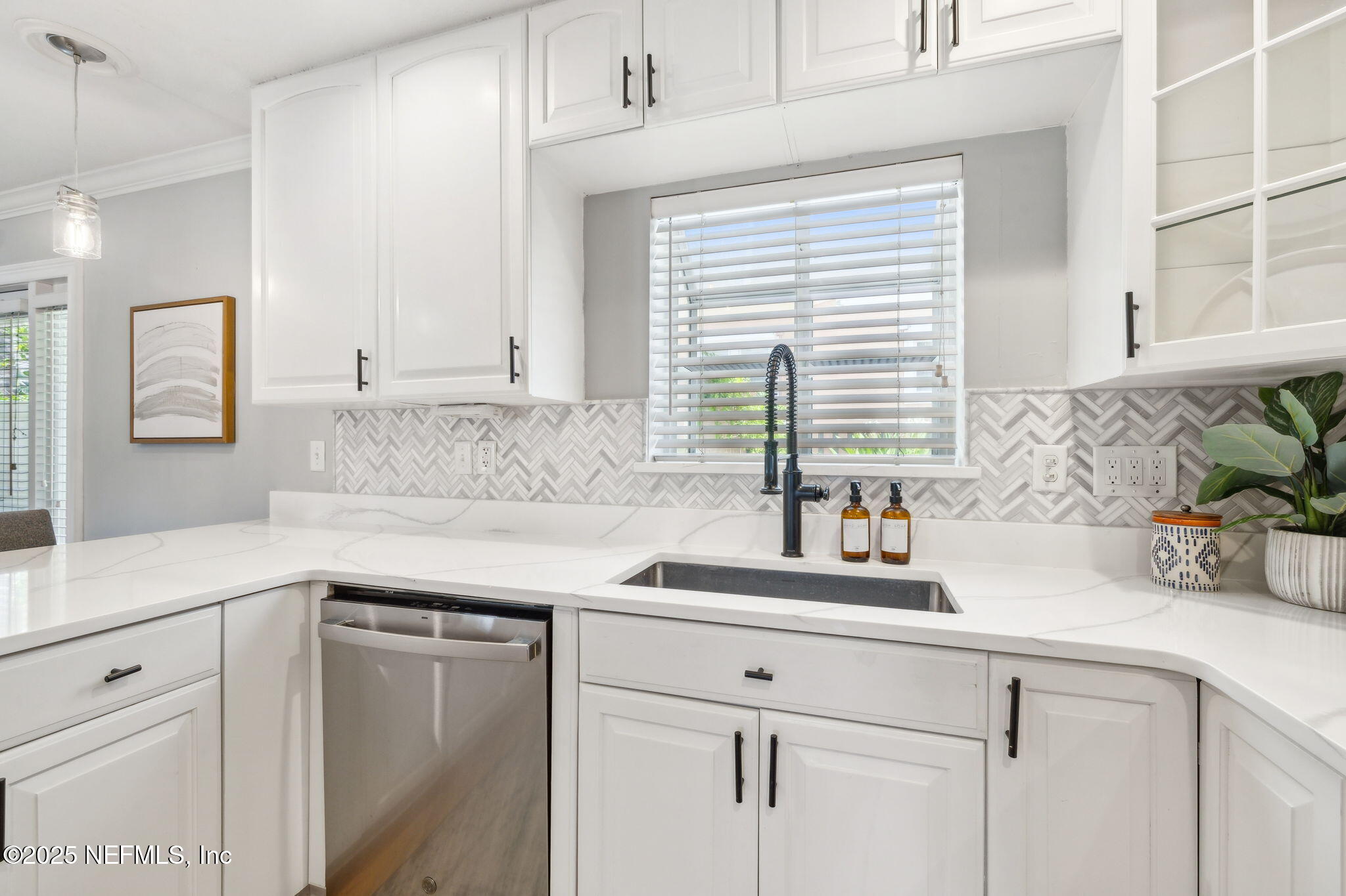 2233 Seminole Road, Unit 10 Atlantic Beach, FL 32233 - Photo 15 of 63 a kitchen with stainless steel appliances white cabinets and a window