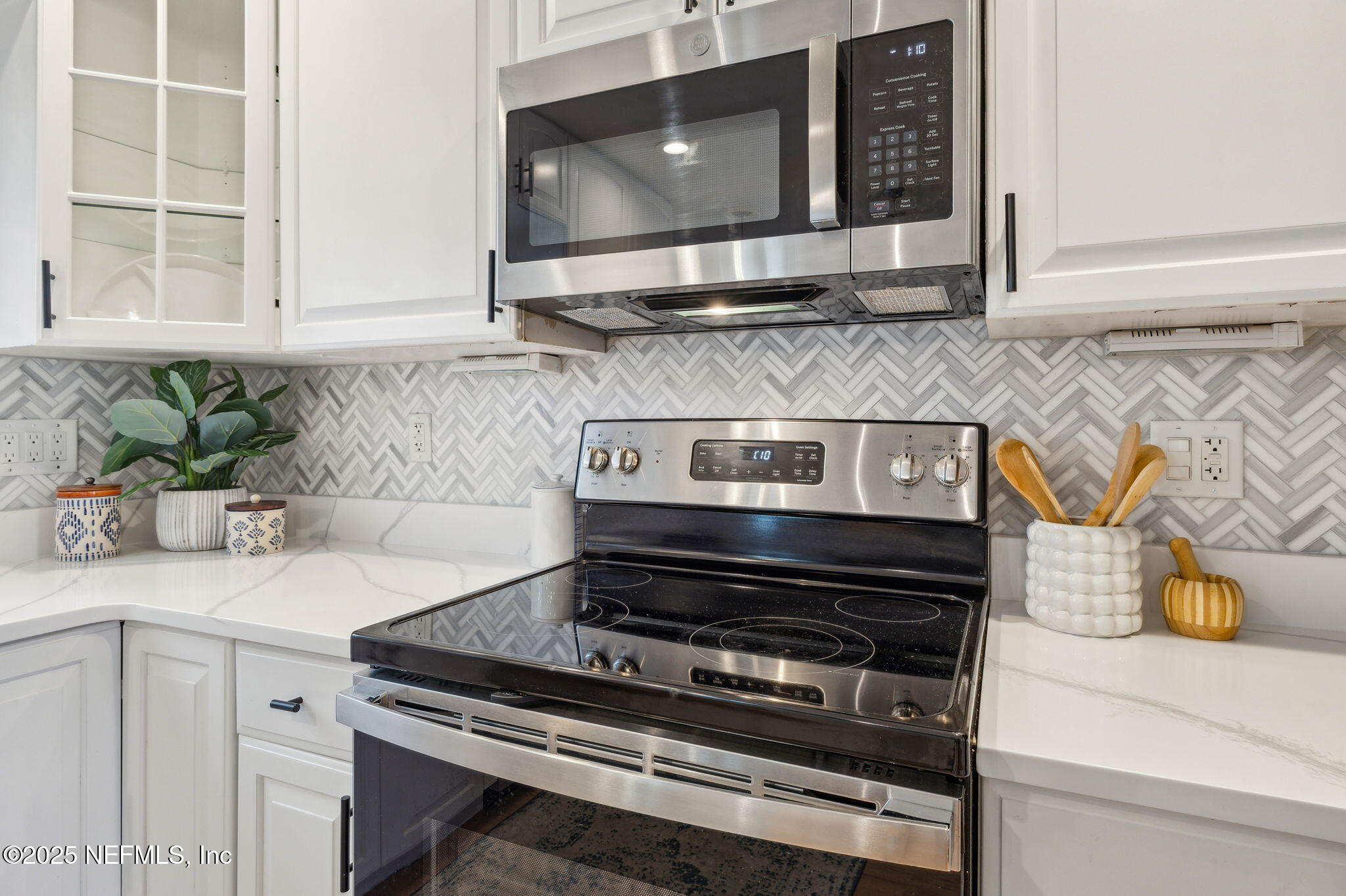 2233 Seminole Road, Unit 10 Atlantic Beach, FL 32233 - Photo 16 of 63 a kitchen with a stove and a microwave