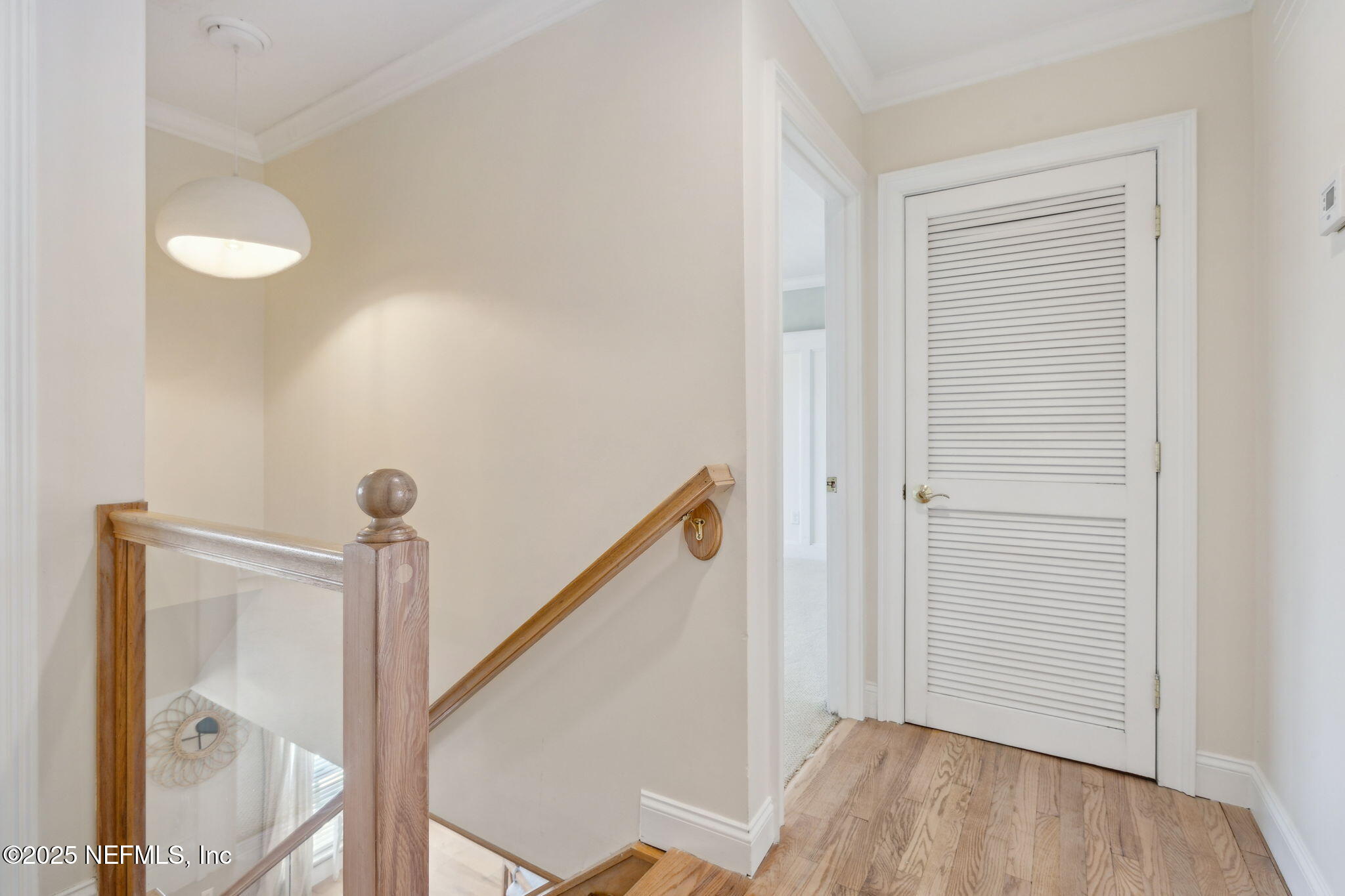 2233 Seminole Road, Unit 10 Atlantic Beach, FL 32233 - Photo 23 of 63 a view of a hallway with wooden floor and staircase