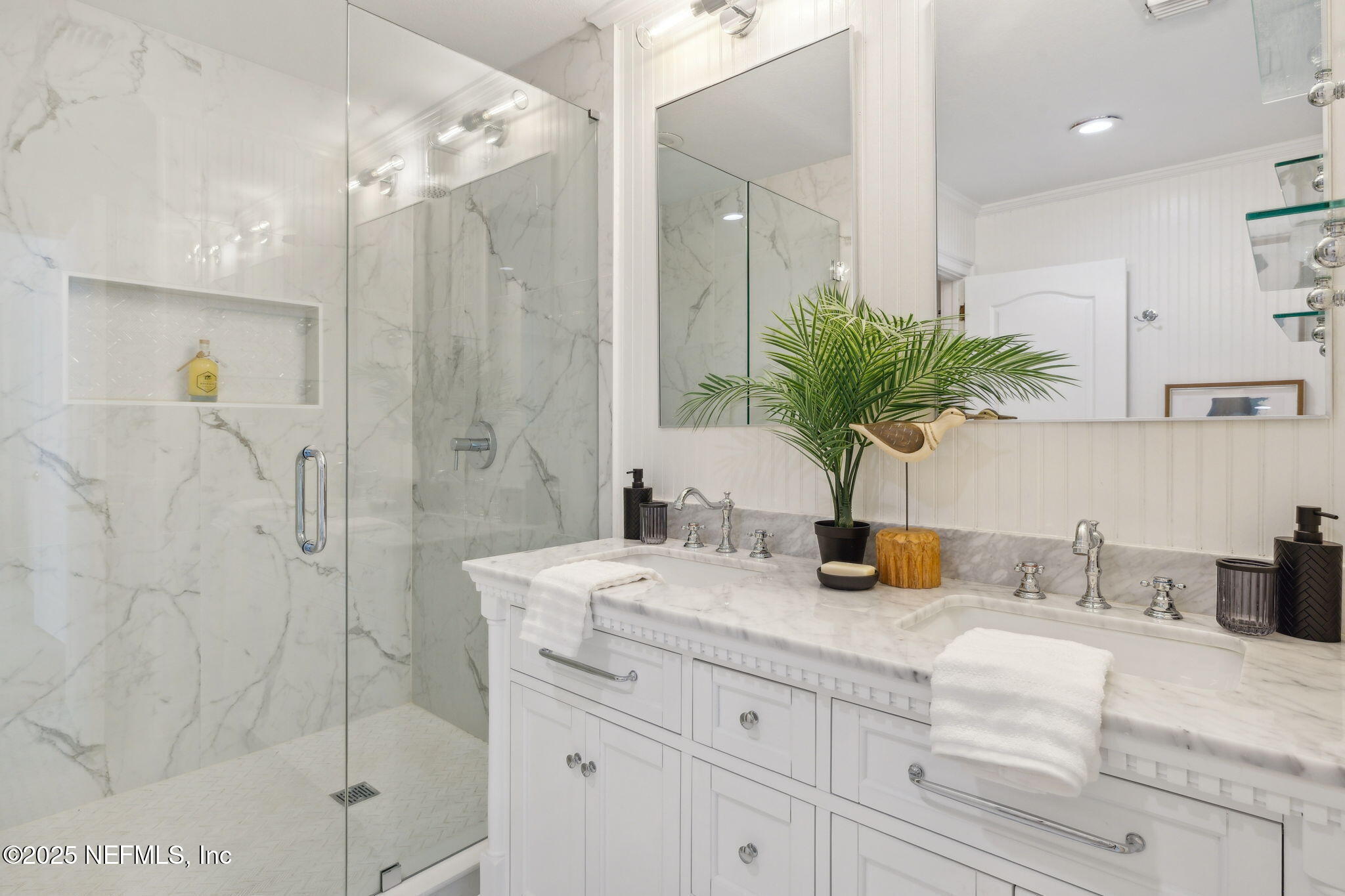 2233 Seminole Road, Unit 10 Atlantic Beach, FL 32233 - Photo 27 of 63 a bathroom with a granite countertop sink a potted plant and a shower