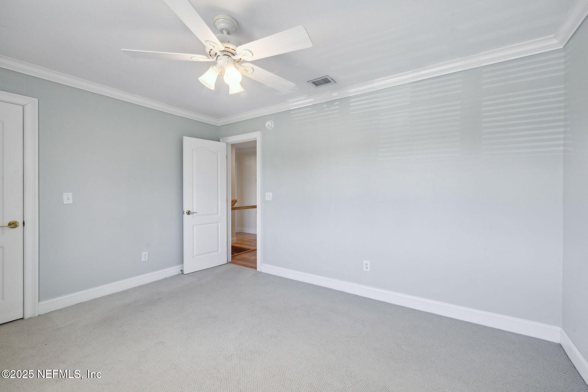 2233 Seminole Road, Unit 10 Atlantic Beach, FL 32233 - Photo 36 of 63 an empty room with a ceiling fan and a window