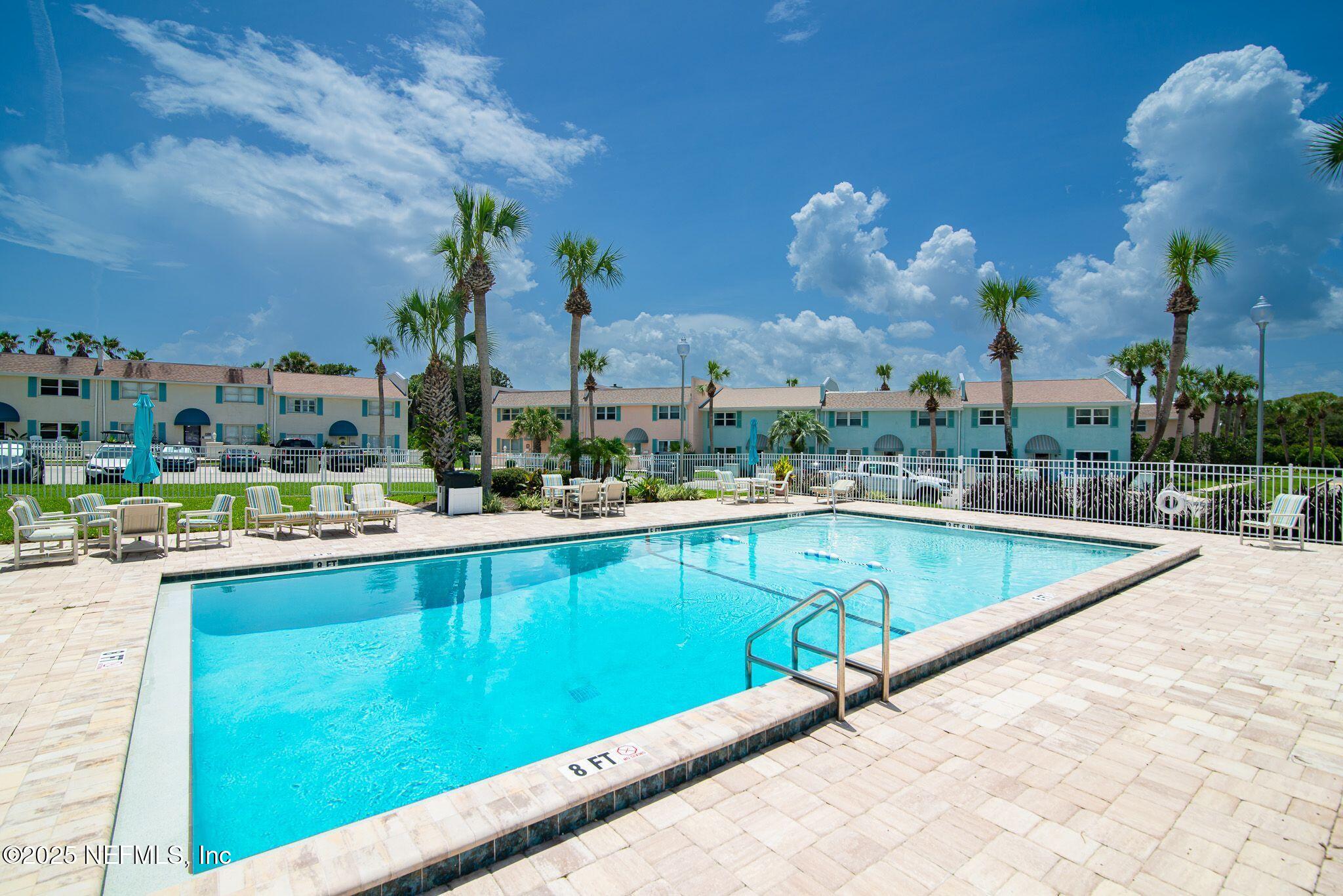 2233 Seminole Road, Unit 10 Atlantic Beach, FL 32233 - Photo 42 of 63 a view of a swimming pool with outdoor seating