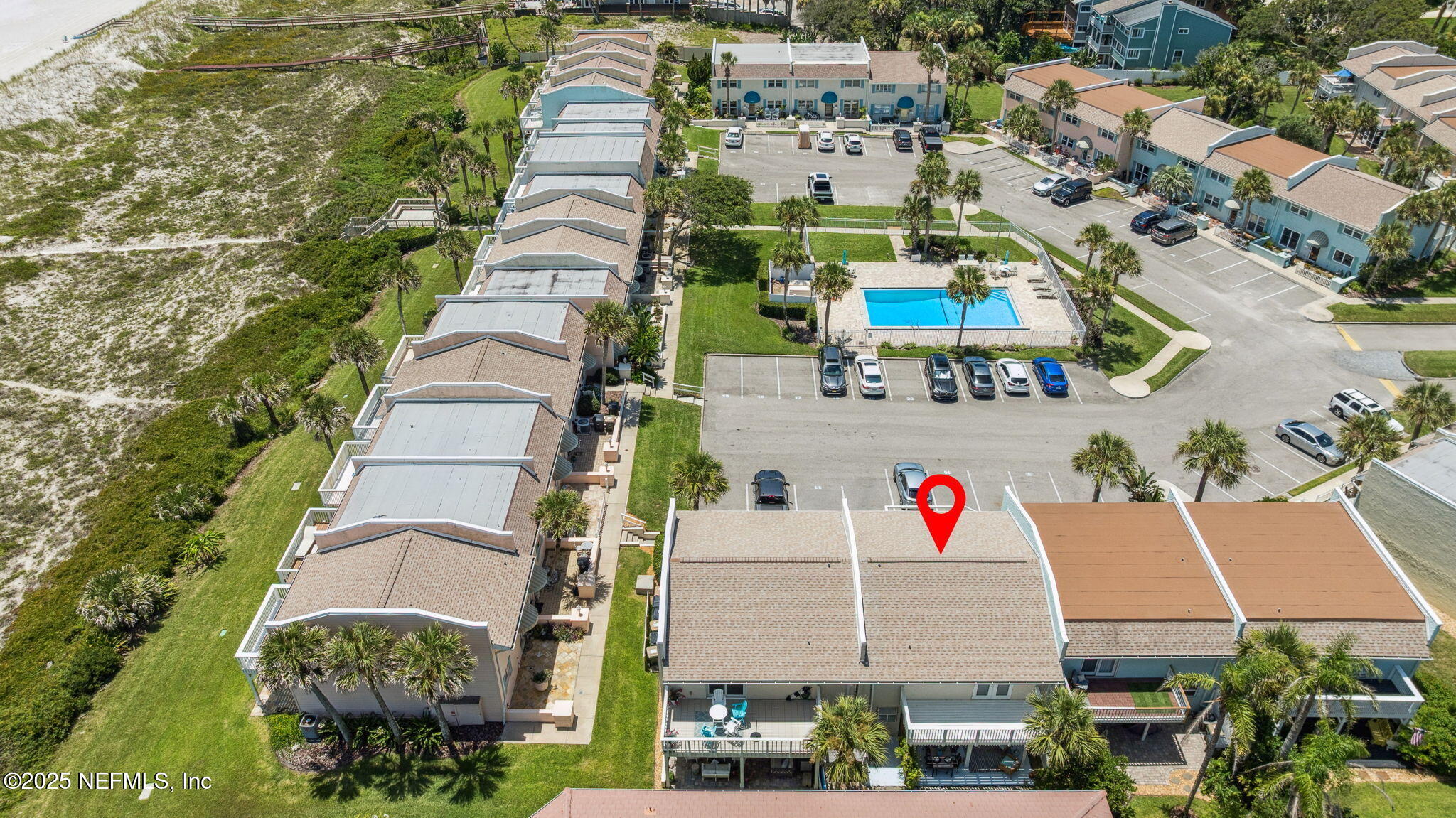 2233 Seminole Road, Unit 10 Atlantic Beach, FL 32233 - Photo 50 of 63 a aerial view of multi story residential apartment building with yard