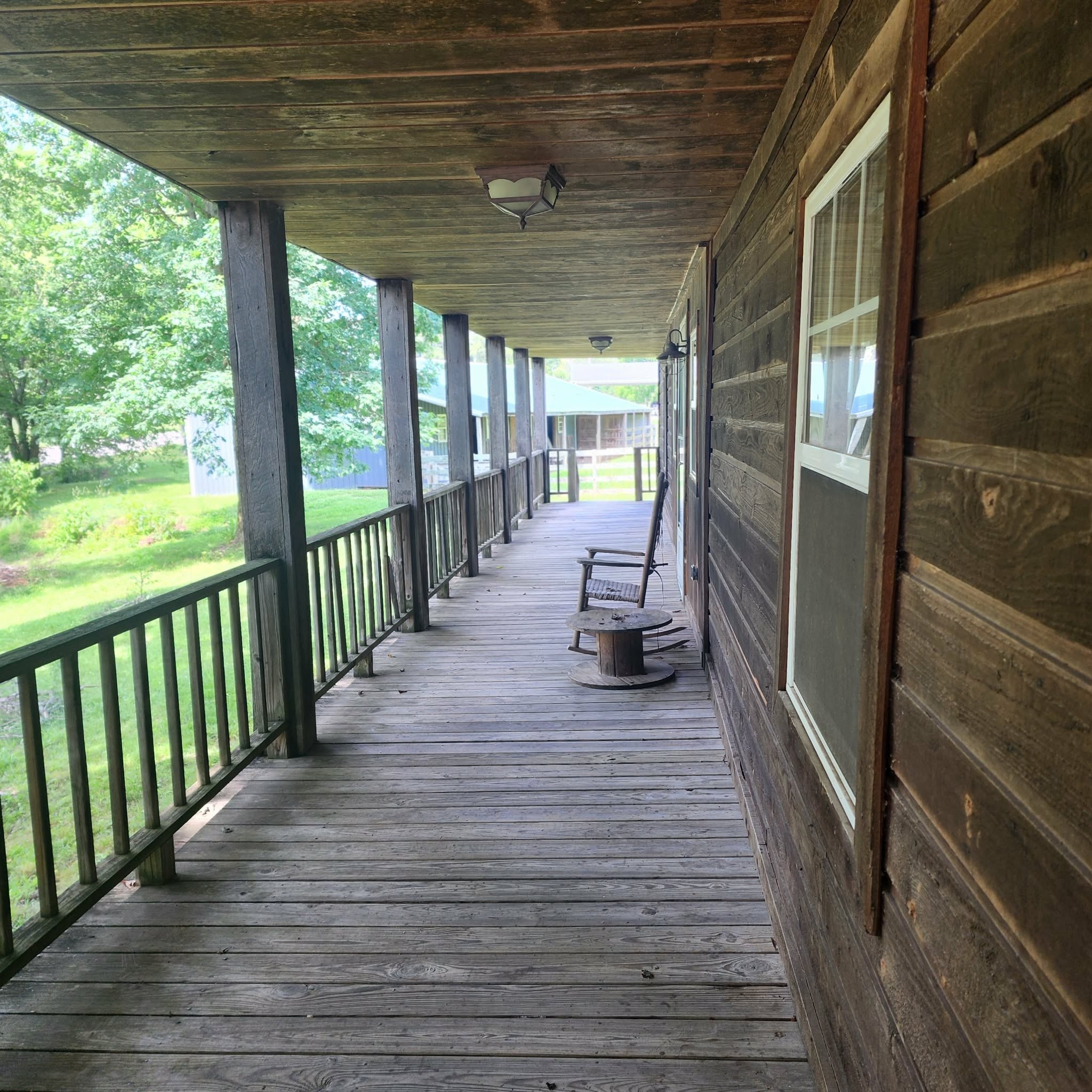 145 Mrs Gower Road Lawrenceburg, TN 38464 - Photo 23 of 26 a porch with wooden floor outdoor seating and yard