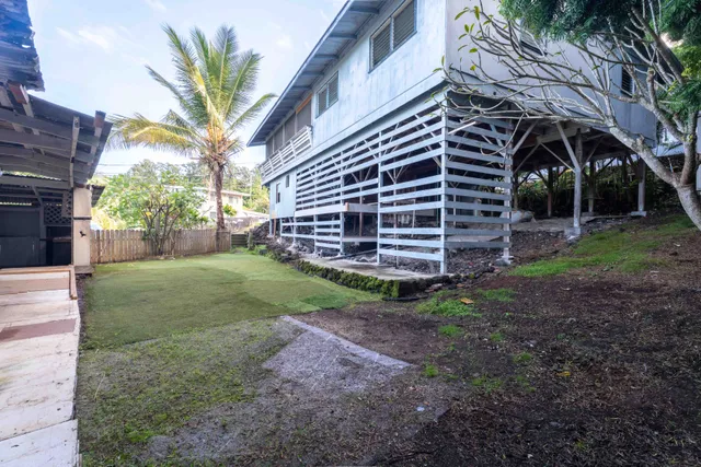 a view of a backyard of the house