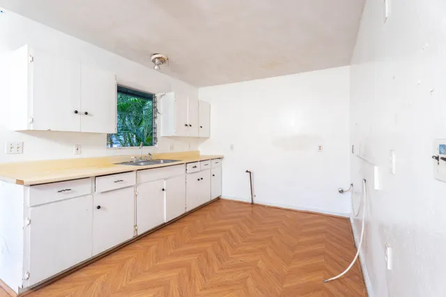 a spacious bathroom with a sink and a mirror