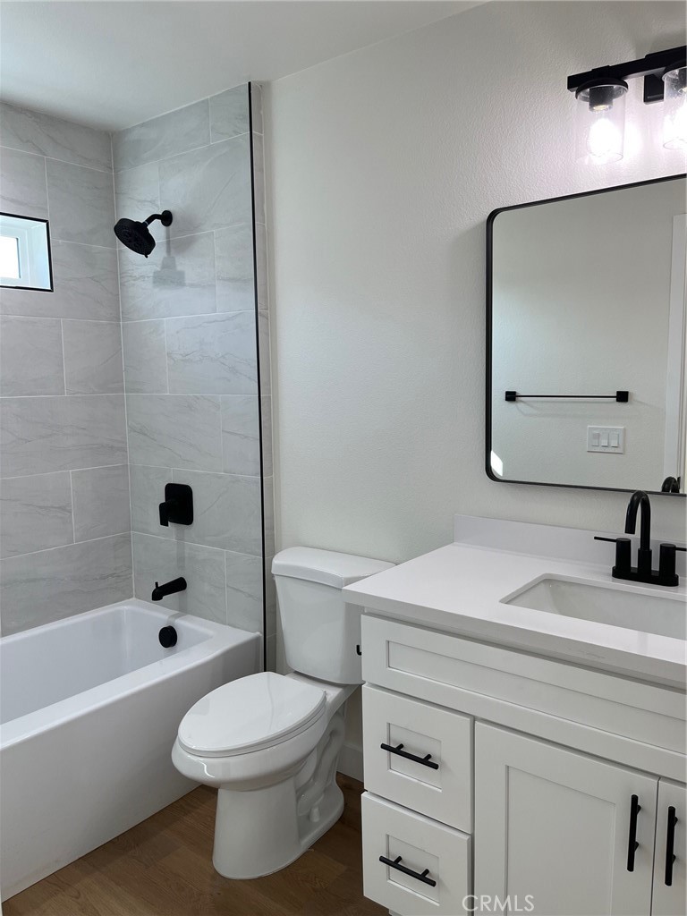 504 East Stuart Avenue, Unit 2 Redlands, CA 92374 - Photo 11 of 22 a bathroom with a sink a toilet and a mirror