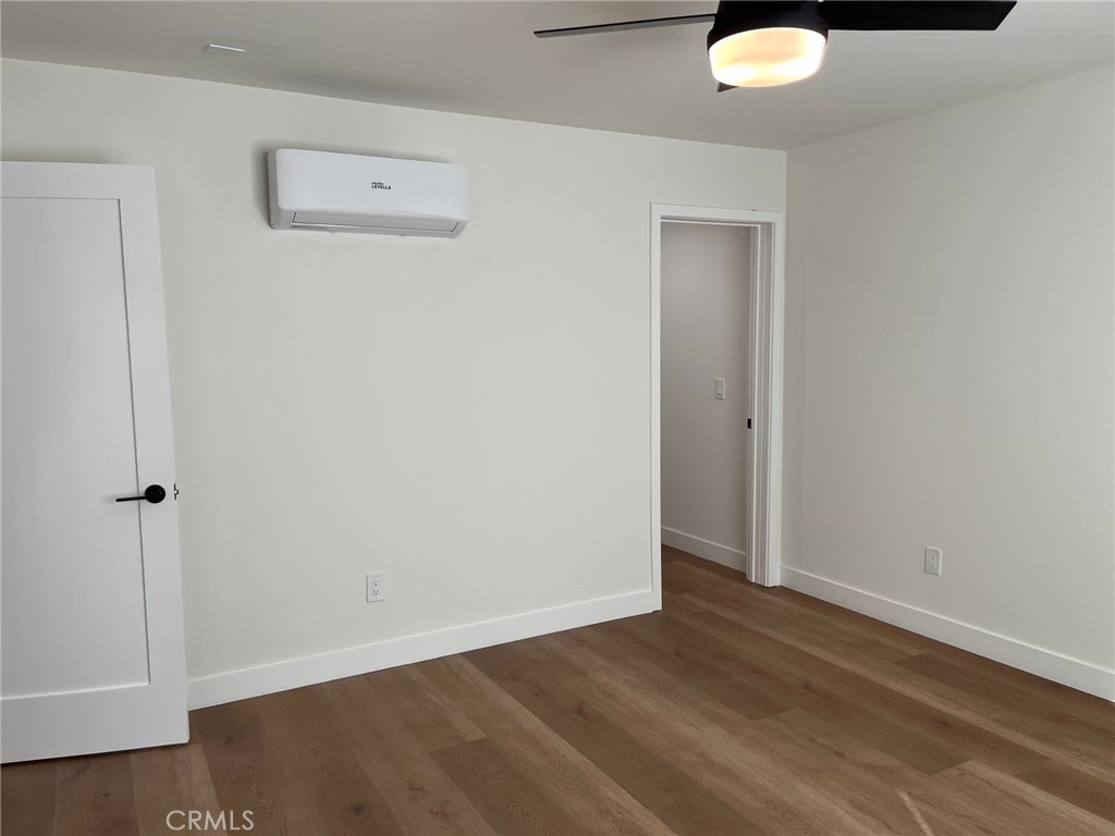 504 East Stuart Avenue, Unit 2 Redlands, CA 92374 - Photo 12 of 22 an empty room with wooden floor