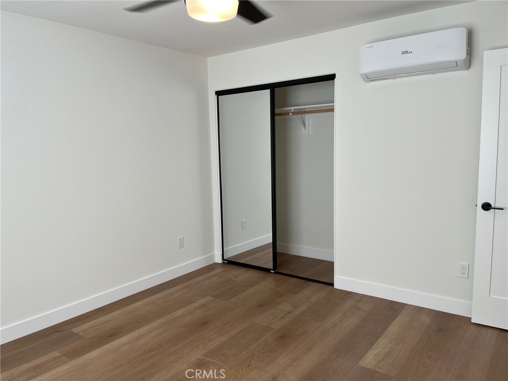 504 East Stuart Avenue, Unit 2 Redlands, CA 92374 - Photo 16 of 22 a view of an empty room with wooden floor