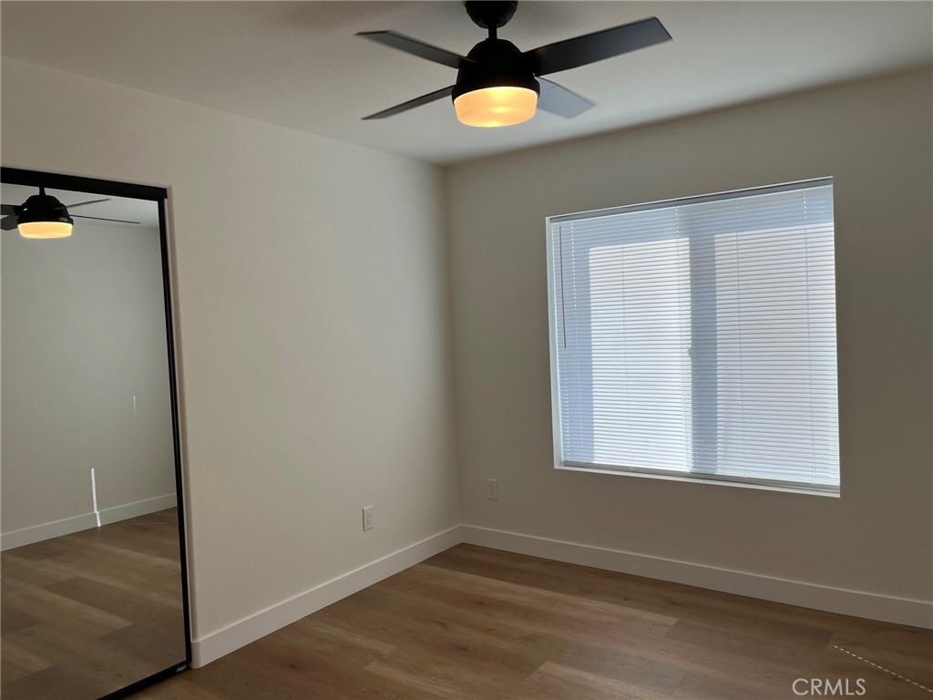 504 East Stuart Avenue, Unit 2 Redlands, CA 92374 - Photo 17 of 22 an empty room with a window and a ceiling fan
