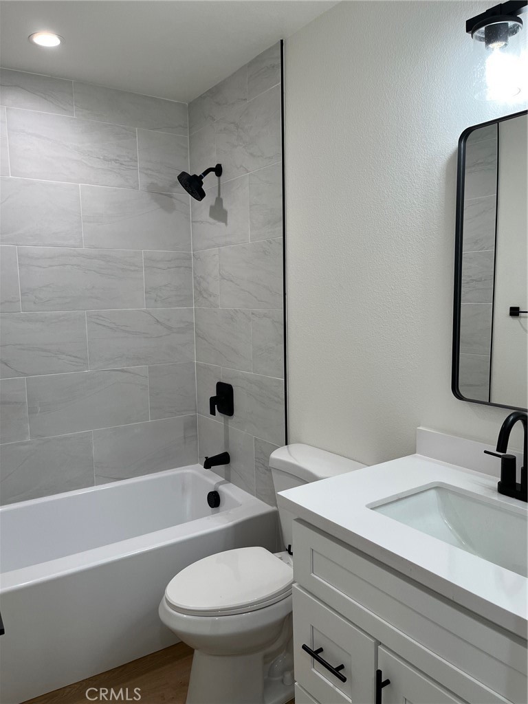 504 East Stuart Avenue, Unit 2 Redlands, CA 92374 - Photo 6 of 22 a bathroom with a sink toilet and shower
